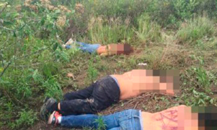 Dejan narcomensaje en espaldas de tres ejecutados en Puebla